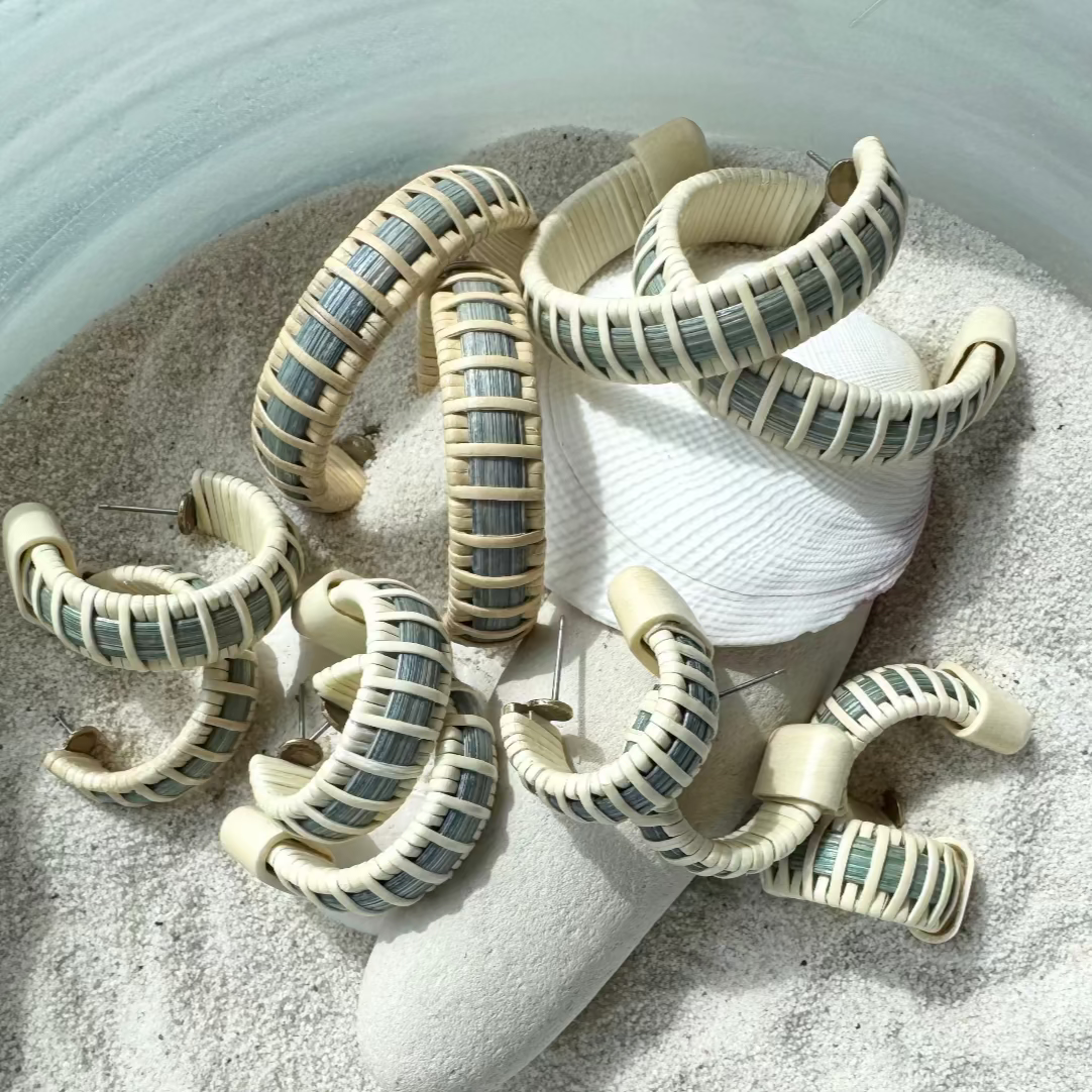 Decorative sea creature with striped pattern on a sandy surface