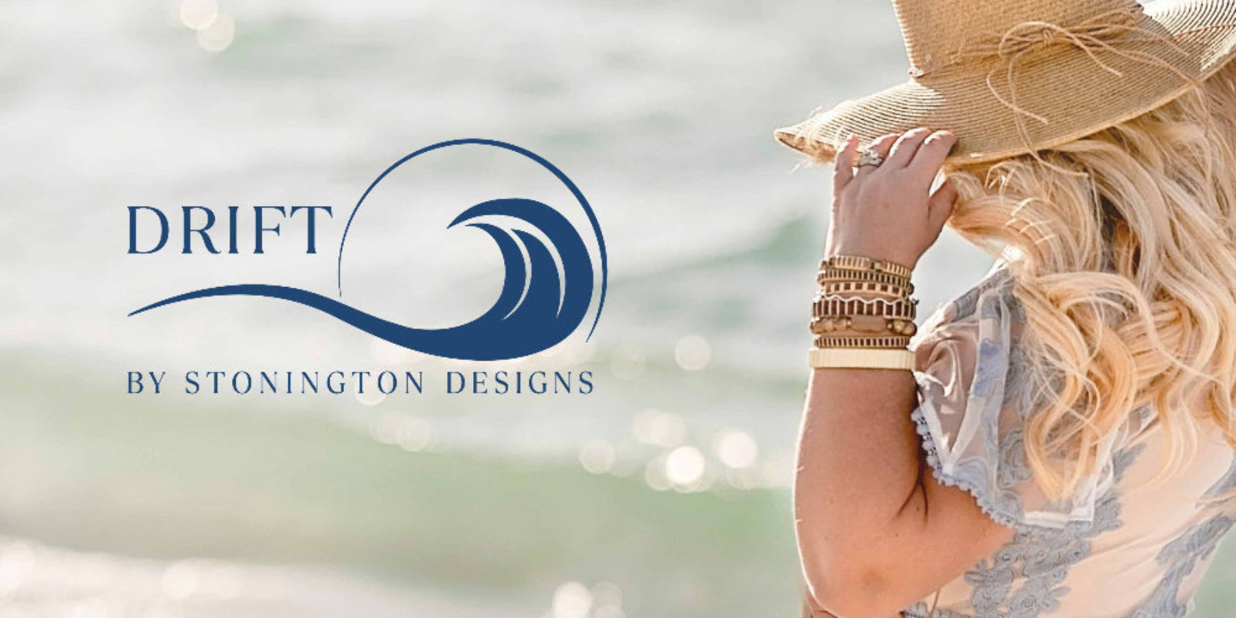 Woman wearing a straw hat with 'Drift by Stonington Designs' logo on a blurred beach background