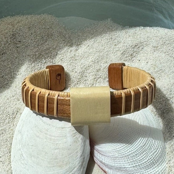 Cherry wood Vista cuff bracelet with a raised holly wood slider bead, a bold wide-profile handcrafted design perfect for solo statement wear — American-made by Military Spouse artisans in Stonington, Connecticut.