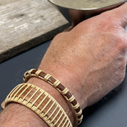 Handcrafted cherry Legacy Cuff Bracelet worn stacked on a man's wrist with a cherry Clubhouse Cuff Bracelet, showing the bold wide silhouette as a statement men's wood bracelet.