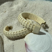 Holly wood Seasons large hoop earrings finished with a light weaver wrap, a bold sculptural design secured with gold post backs — American-made by Military Spouse artisans in Stonington, Connecticut.