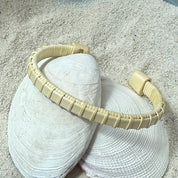 Holly wood Symphony cuff bracelet with a light weaver wrap, handcrafted for understated everyday elegance — American-made by Military Spouse artisans in Stonington, Connecticut.