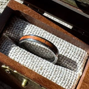 Handcrafted Whisper 4mm tungsten ring with a mahogany wood inlay, displayed in a handcrafted wooden gift box.