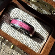 Beacon 8mm tungsten ring with purple heart wood inlay nestled in an open Drift by Stonington Designs engraved wooden gift box.