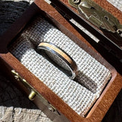 Handcrafted Whisper 4mm tungsten ring with a white oak inlay, displayed in a handcrafted wooden gift box.