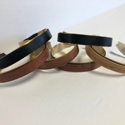 3 tyoes of wood around brass cuffs to show various woods available walnut cherry, purple hear, ebony