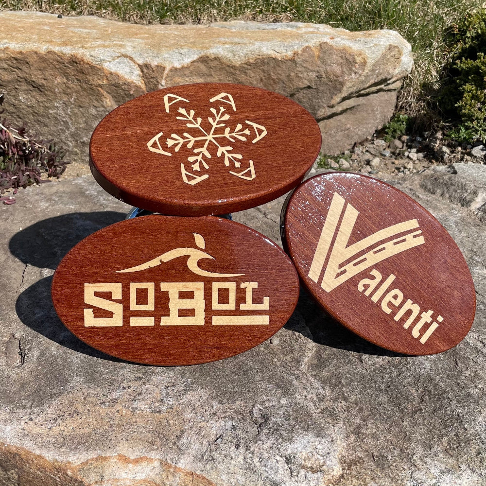 various inlay designed of hitch covers in mahgany with maple on background of rock
