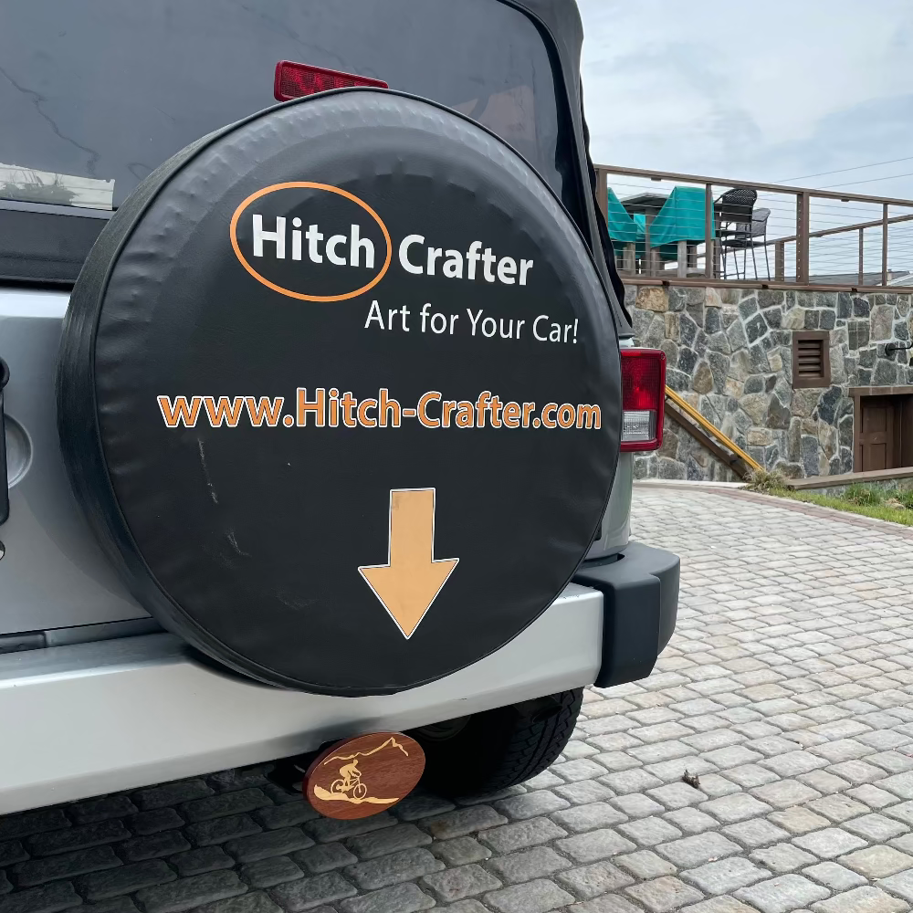 mountain biker hitch cover on back of jeep